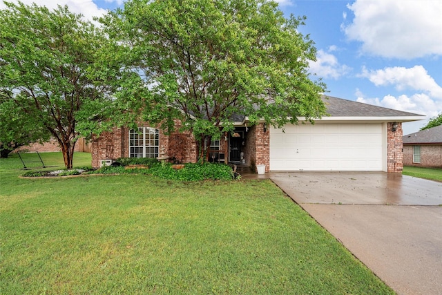 view of front of house featuring driveway, a front yard, brick siding, and a garage