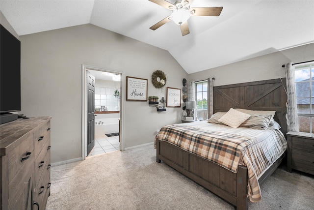 bedroom featuring baseboards, light colored carpet, and lofted ceiling