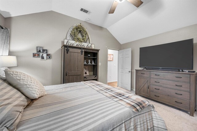 bedroom with visible vents, a ceiling fan, vaulted ceiling, and light carpet