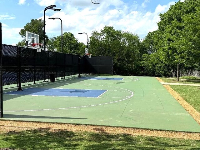 view of sport court with fence and community basketball court