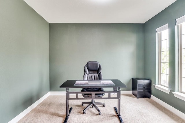 carpeted office featuring a healthy amount of sunlight and baseboards