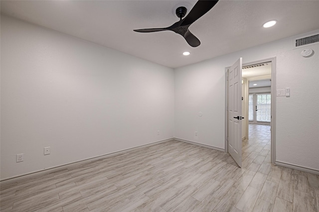 unfurnished room with ceiling fan, light wood-type flooring, recessed lighting, and visible vents
