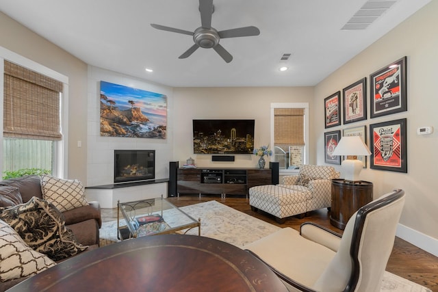 5313 Ridgedale Ave, Dallas, TX 75206 - living room featuring wood finished floors, a ceiling fan, baseboards, a glass covered fireplace, and recessed lighting