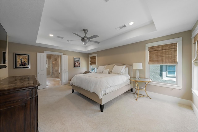 5313 Ridgedale Ave, Dallas, TX 75206 - bedroom with a raised ceiling, light colored carpet, baseboards, a ceiling fan, and recessed lighting
