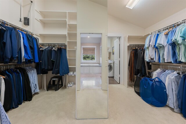5313 Ridgedale Ave, Dallas, TX 75206 - walk in closet featuring washer / dryer, vaulted ceiling, and carpet