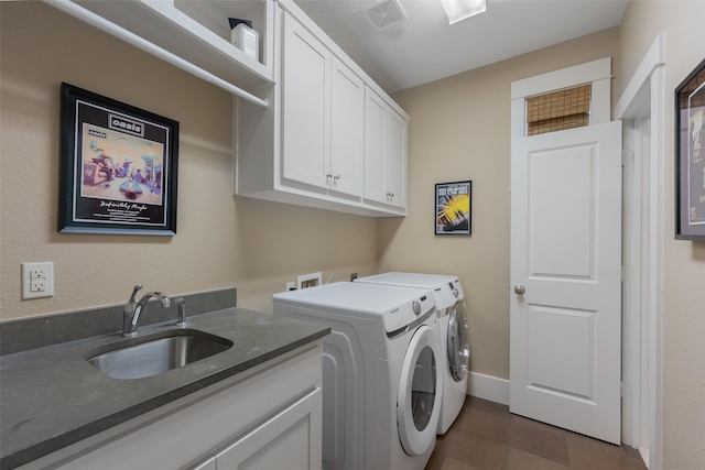 5313 Ridgedale Ave, Dallas, TX 75206 - laundry room featuring washer and dryer, cabinet space, and baseboards