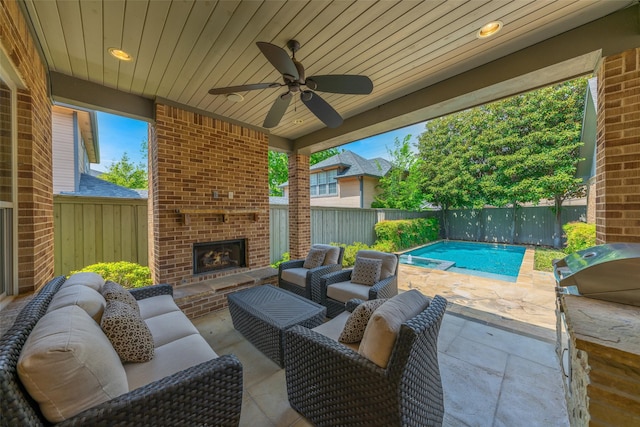 5313 Ridgedale Ave, Dallas, TX 75206 - fenced backyard with a patio, an outdoor living space with a fireplace, ceiling fan, and a grill
