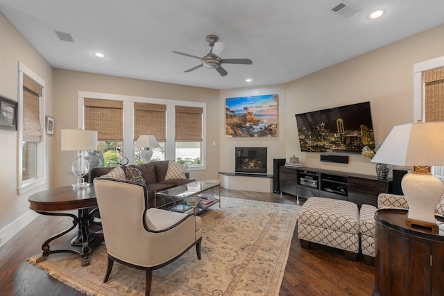 5313 Ridgedale Ave, Dallas, TX 75206 - living room featuring ceiling fan, a glass covered fireplace, recessed lighting, wood finished floors, and baseboards