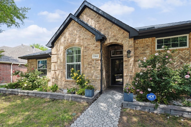 view of front of house featuring brick siding