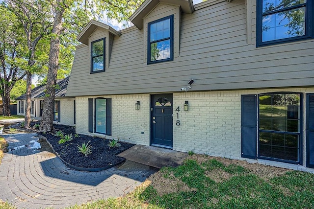 view of front of property featuring brick siding