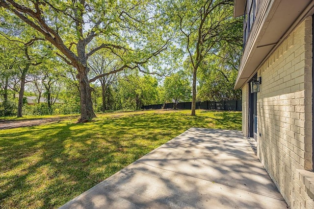 view of yard with a patio and fence