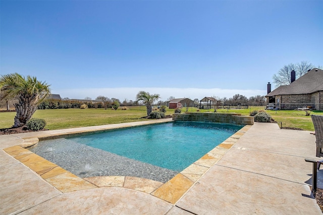 pool with a yard and a patio area