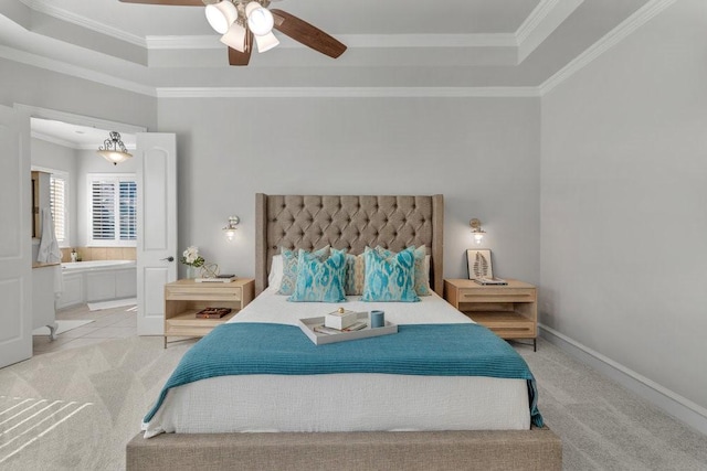 bedroom with light colored carpet, crown molding, and a tray ceiling