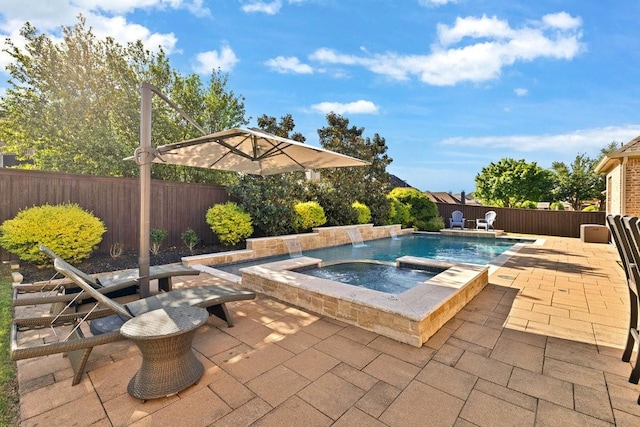 view of pool featuring a fenced backyard, a fenced in pool, an in ground hot tub, and a patio area