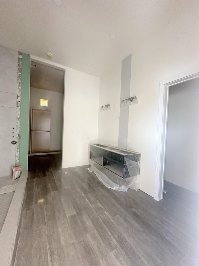 unfurnished living room with wood finished floors