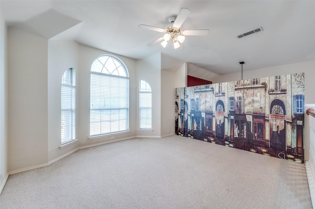spare room featuring baseboards, visible vents, a ceiling fan, and carpet floors