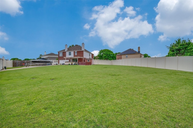 view of yard with a fenced backyard