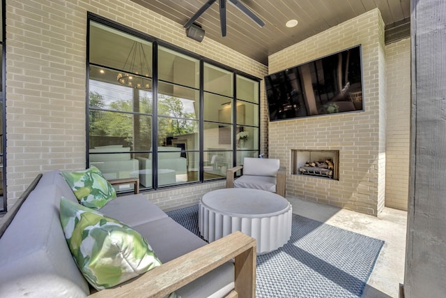 view of patio / terrace featuring an outdoor brick fireplace