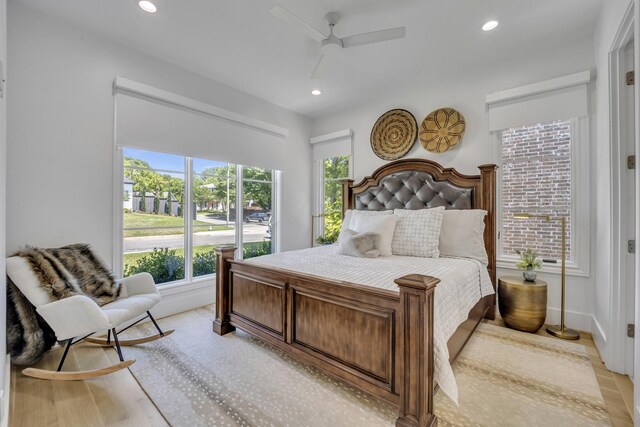 bedroom featuring baseboards, recessed lighting, light wood-type flooring, and a ceiling fan