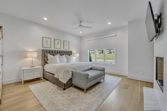 7141 Lyre Ln, Dallas, TX 75214 - bedroom with recessed lighting, baseboards, light wood-style floors, a ceiling fan, and a fireplace with flush hearth