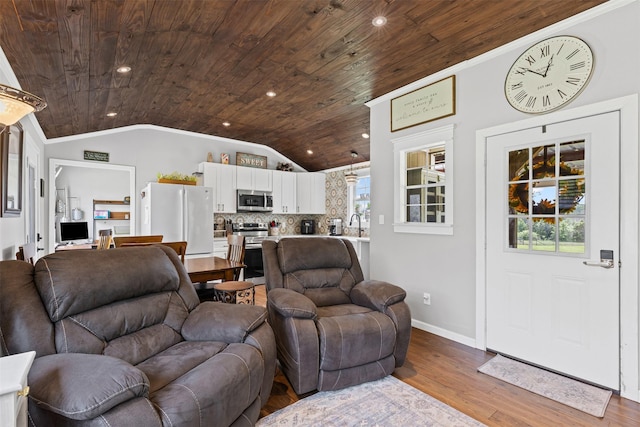living room with wood ceiling, baseboards, wood finished floors, and lofted ceiling