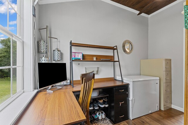 office space featuring baseboards, ornamental molding, and wood finished floors