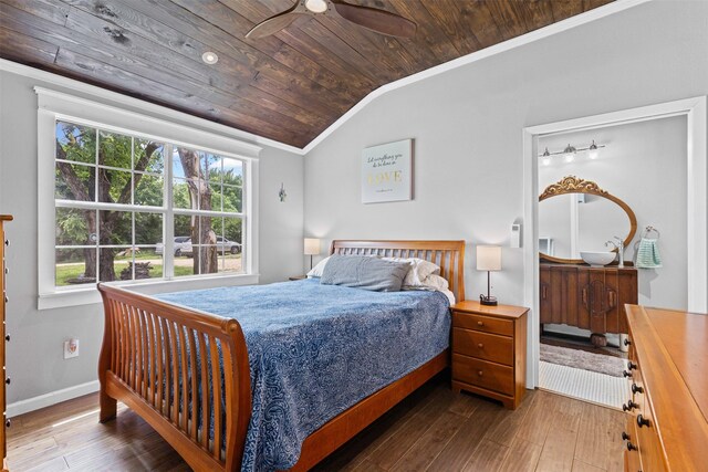 bedroom with crown molding, wood ceiling, vaulted ceiling, and hardwood / wood-style floors
