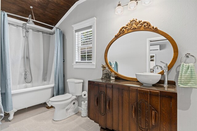 full bathroom with vanity, shower / tub combo with curtain, lofted ceiling, toilet, and a wall mounted AC