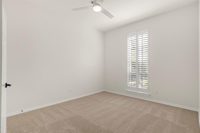 unfurnished room with a ceiling fan, carpet flooring, and plenty of natural light