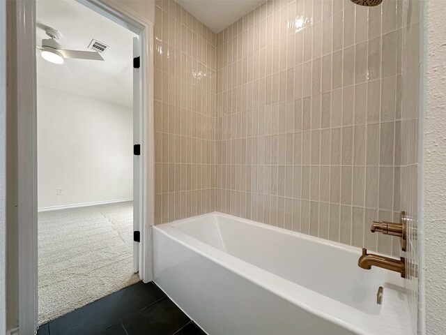 bathroom with tile patterned floors, visible vents, ceiling fan, and shower / tub combination