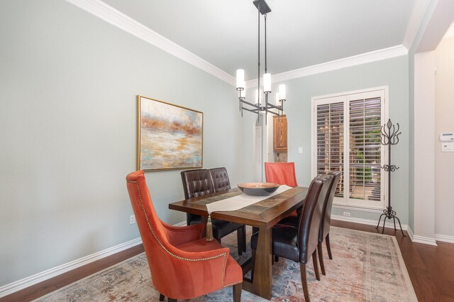 905 Maybach Ct, Mckinney, TX 75071 - dining area featuring baseboards, ornamental molding, wood finished floors, and a chandelier
