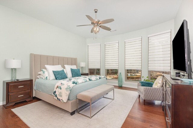 905 Maybach Ct, Mckinney, TX 75071 - bedroom with ceiling fan, baseboards, and dark wood-type flooring