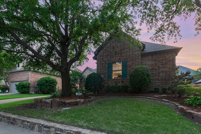 905 Maybach Ct, Mckinney, TX 75071 - view of front of property featuring a garage, a front lawn, brick siding, a shingled roof, and driveway