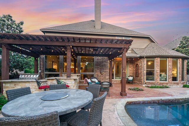 905 Maybach Ct, Mckinney, TX 75071 - back of property at dusk featuring area for grilling, brick siding, a patio, a pergola, and outdoor dining area