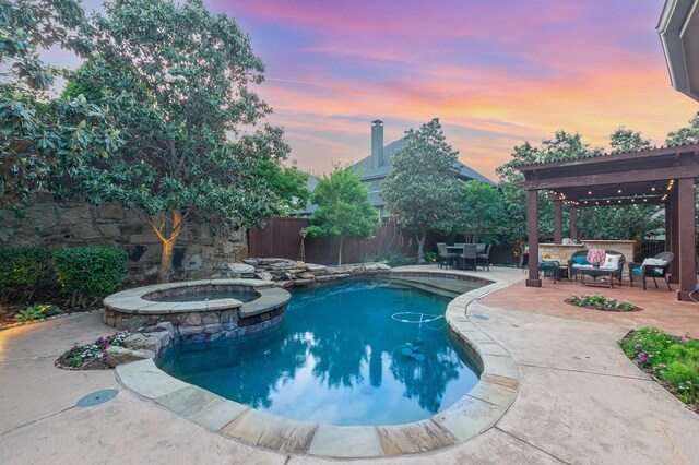 905 Maybach Ct, Mckinney, TX 75071 - view of swimming pool featuring a patio area, a pool with connected hot tub, and a fenced backyard