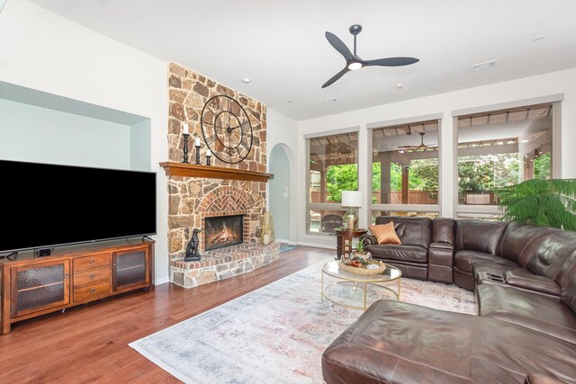 905 Maybach Ct, Mckinney, TX 75071 - living room with a ceiling fan, visible vents, wood finished floors, and a fireplace