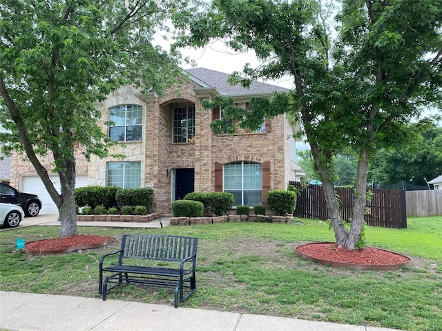 3115 Reagenea Dr, Wylie, TX 75098 - view of front of home featuring brick siding, a front lawn, and fence