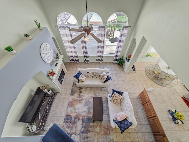 3115 Reagenea Dr, Wylie, TX 75098 - living area featuring a ceiling fan and a towering ceiling