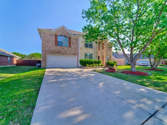 3115 Reagenea Dr, Wylie, TX 75098 - traditional-style home featuring driveway, a front yard, a garage, brick siding, and fence