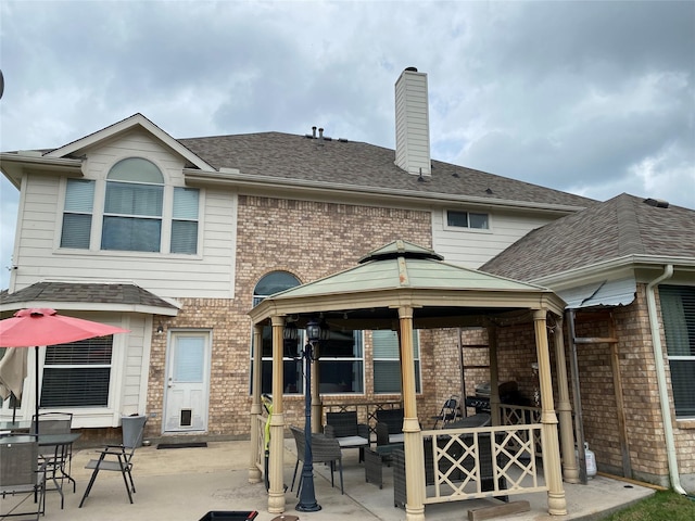 3115 Reagenea Dr, Wylie, TX 75098 - rear view of property with brick siding, a gazebo, an outdoor living space, and a patio area