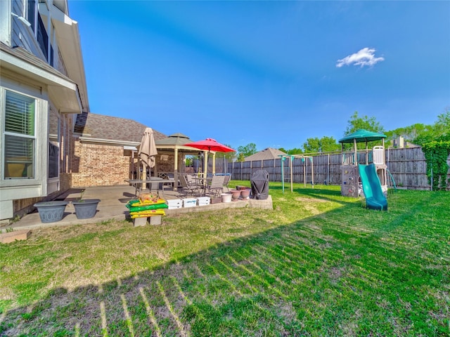 3115 Reagenea Dr, Wylie, TX 75098 - view of yard featuring a fenced backyard, a playground, and a patio area