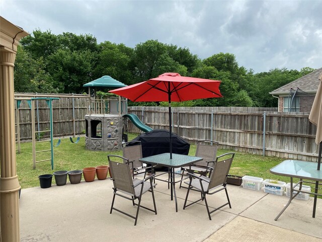 3115 Reagenea Dr, Wylie, TX 75098 - view of patio / terrace with a playground, outdoor dining space, and a fenced backyard