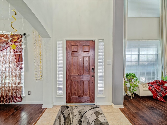 3115 Reagenea Dr, Wylie, TX 75098 - foyer entrance featuring baseboards, a high ceiling, and wood finished floors
