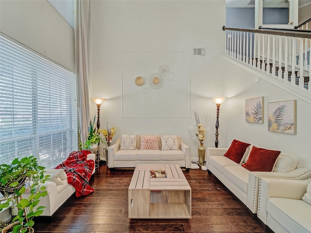 3115 Reagenea Dr, Wylie, TX 75098 - living area with visible vents, a high ceiling, dark wood-style floors, and stairway