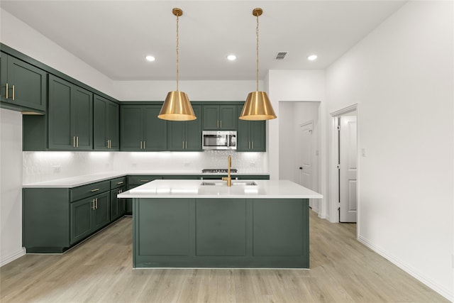 921 Janwood, Plano, TX 75075 - kitchen with green cabinetry, stainless steel appliances, light wood-type flooring, and recessed lighting