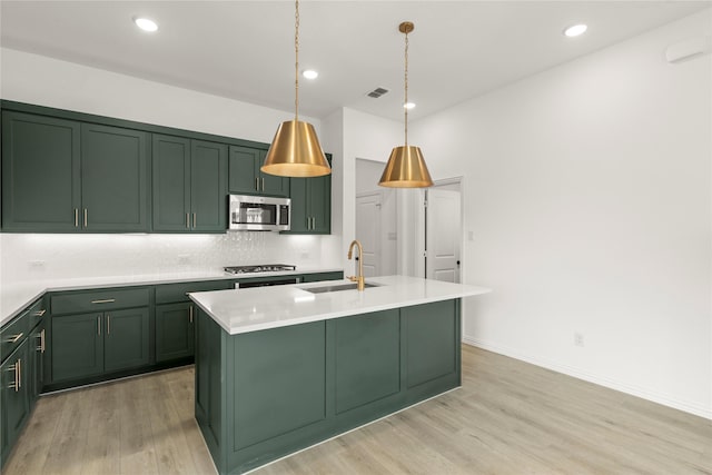 921 Janwood, Plano, TX 75075 - kitchen with green cabinetry, a sink, stainless steel microwave, gas stovetop, and recessed lighting