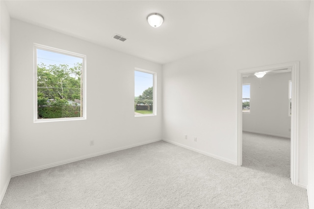 921 Janwood, Plano, TX 75075 - empty room featuring light colored carpet and baseboards