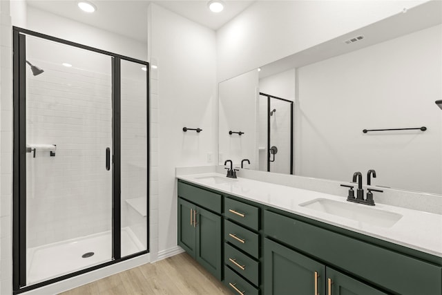 921 Janwood, Plano, TX 75075 - bathroom with a shower stall, wood finished floors, double vanity, and recessed lighting