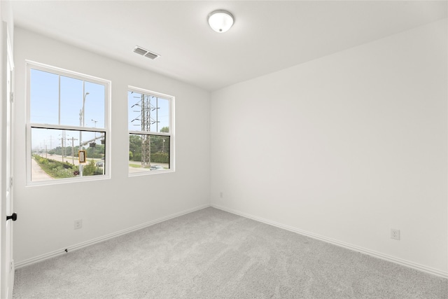 921 Janwood, Plano, TX 75075 - spare room featuring carpet and baseboards