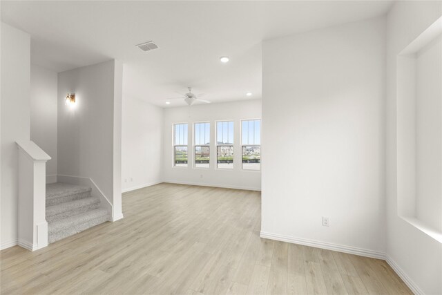 921 Janwood, Plano, TX 75075 - spare room with recessed lighting, ceiling fan, baseboards, light wood-style floors, and stairway